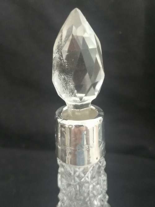 TWO PRETTY CRYSTAL PERFUME BOTTLES WITH SILVER COLLARS