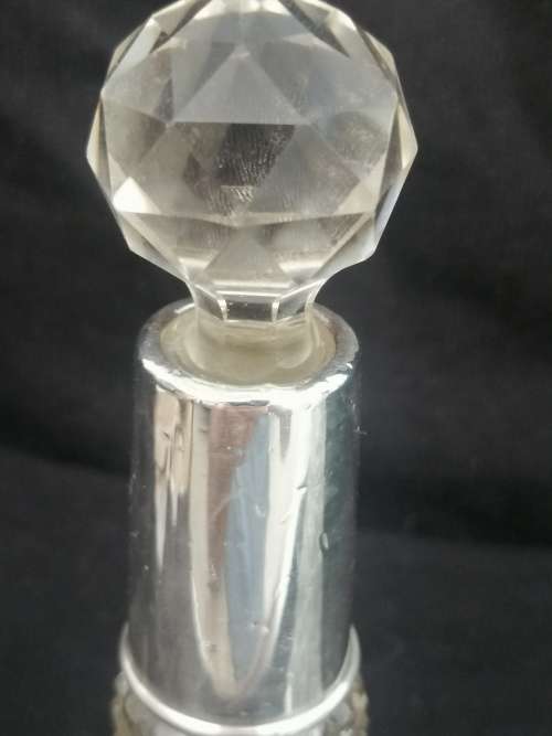 TWO PRETTY CRYSTAL PERFUME BOTTLES WITH SILVER COLLARS