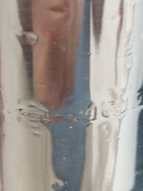 TWO PRETTY CRYSTAL PERFUME BOTTLES WITH SILVER COLLARS