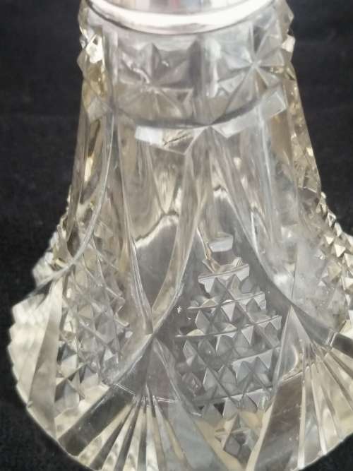 TWO PRETTY CRYSTAL PERFUME BOTTLES WITH SILVER COLLARS