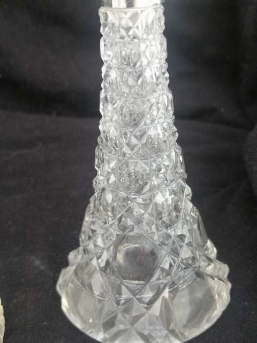 TWO PRETTY CRYSTAL PERFUME BOTTLES WITH SILVER COLLARS