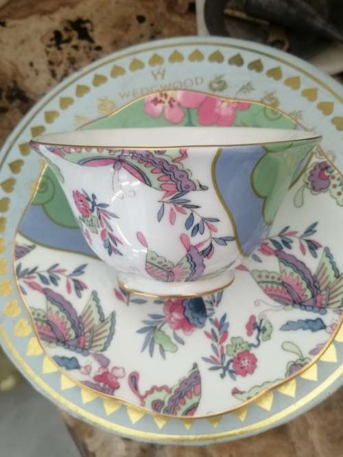 A BOXED WEDGEWOOD`THE TEA STORY COLLECTION` NEVER USED CUP AND SAUCER