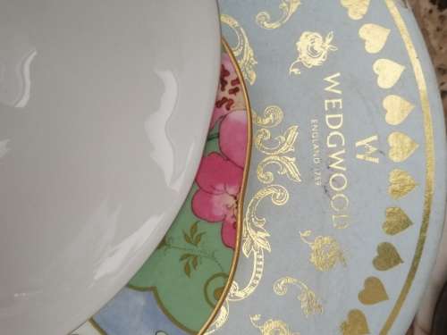 A BOXED WEDGEWOOD`THE TEA STORY COLLECTION` NEVER USED CUP AND SAUCER