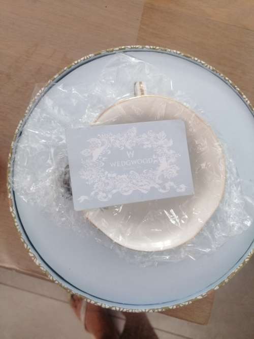 A BOXED WEDGEWOOD`THE TEA STORY COLLECTION` NEVER USED CUP AND SAUCER