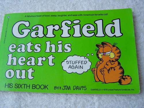 Garfield eats his heart out by Jim Davis. First Edition March 1983