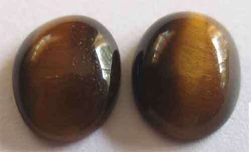 2 pieces, 9.00 x 7.00 mm Tiger eye T.W. 2.89 ct