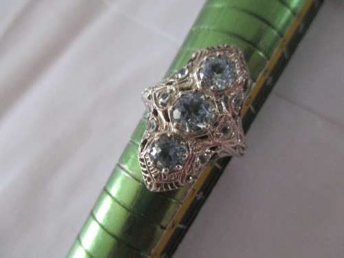 Decorative -Sterling Silver and Genuine Sky Blue Topaz Ring.