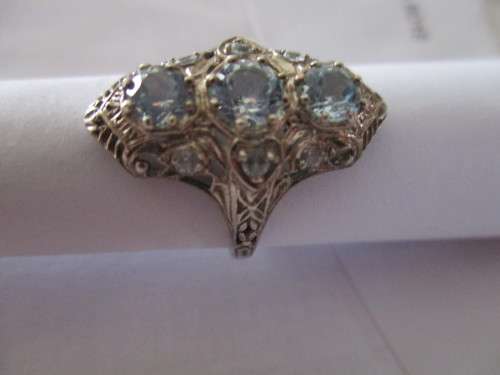 Decorative -Sterling Silver and Genuine Sky Blue Topaz Ring.