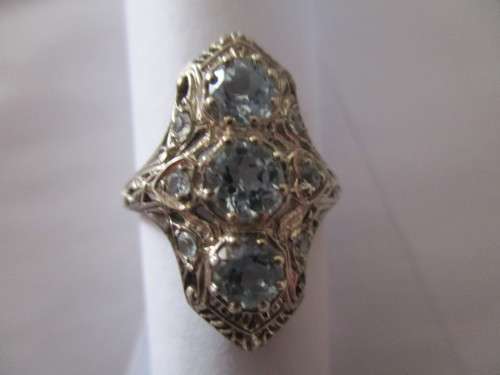 Decorative -Sterling Silver and Genuine Sky Blue Topaz Ring.