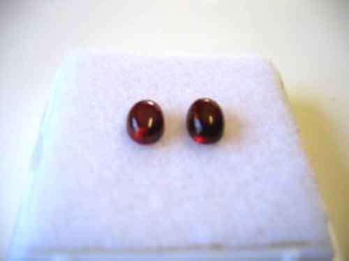 2 pieces 6.00 x 4.00mm Oval Cab Garnets T. W. 1.51 ct.