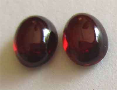 2 pieces 6.00 x 4.00mm Oval Cab Garnets T. W. 1.51 ct.