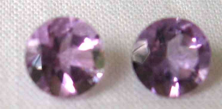 2 pieces of  5.00 mm Round cut Amethysts, T. W.  0.88 cts.