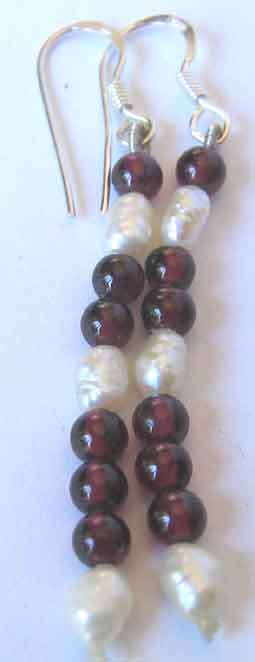 A beautiful  pair of Sterling Silver , Fresh Water Pearls  and Garnets  Earrings.