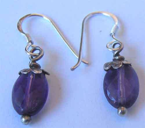 A pair of Sterling Silver and  Genuine Amethysts  Earrings.