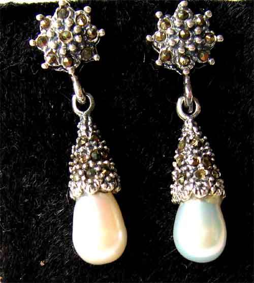 A pair of Sterling Silver, Pearls and Marcasite Drop Earrings.