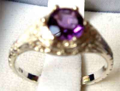Sterling Silver and Amethyst Solitaire Ring .