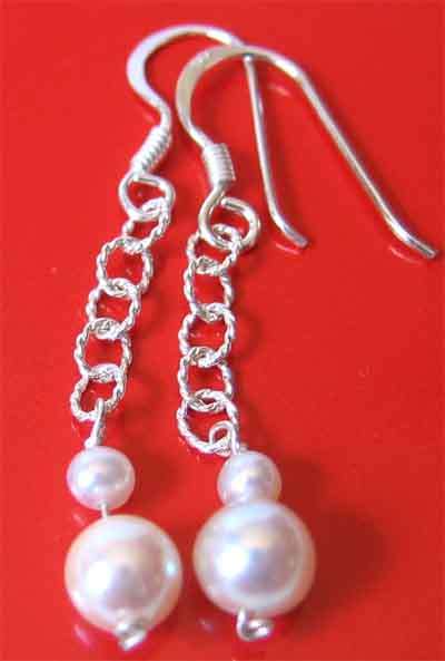 A pair of   Sterling Silver and Genuine Cultured Pearls  Dangle  Earrings