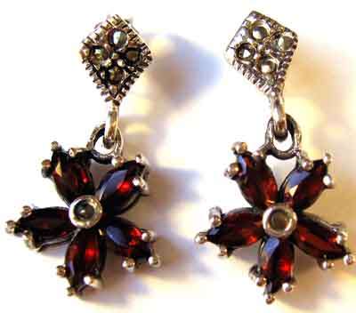 A pair of Sterling Silver, Marcasite and Granets Earrings.