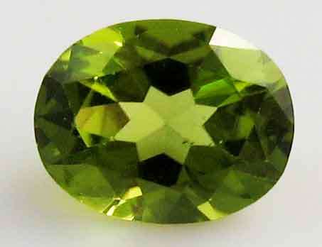 Genuine 10.00 x 8.00 mm Oval faceted  cut Peridot 2.48 ct.