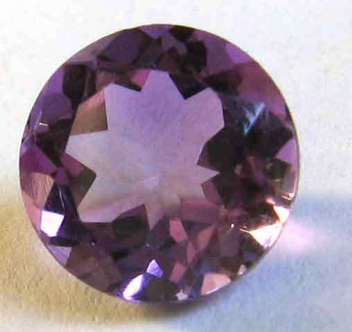 Superb, 9.00 mm round facetsd cut Amethyst  2.16 ct.