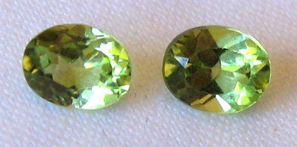 1 lot, 2 pieces  5.00 x 4.00 mm Oval faceted cut Peridots, T. W.  0.74 ct.