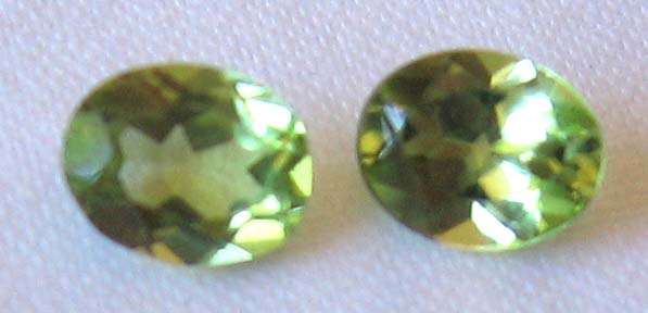 2 pieces 5.00 x 4.00 mm Oval Faceted cut Peridots, T. W.  0.81 ct.