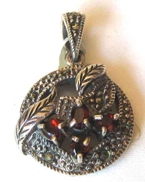 Sterling Silver , Marcasite and Garnets Pendant .
