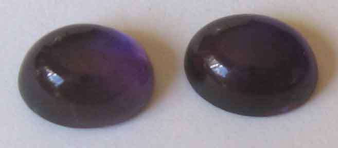 1 lot, 2 pieces  6.00 x 8.00 mm Oval Cabachon cut Amethysts, T. W. 2.55  cts.