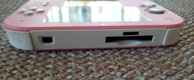 pink nintendo 2ds console with  original charger and carry case with memory card