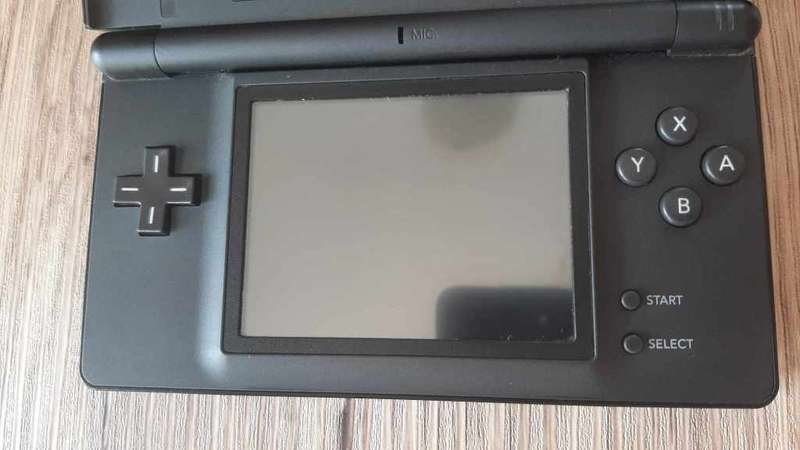 Nintendo ds lite console with charger and games