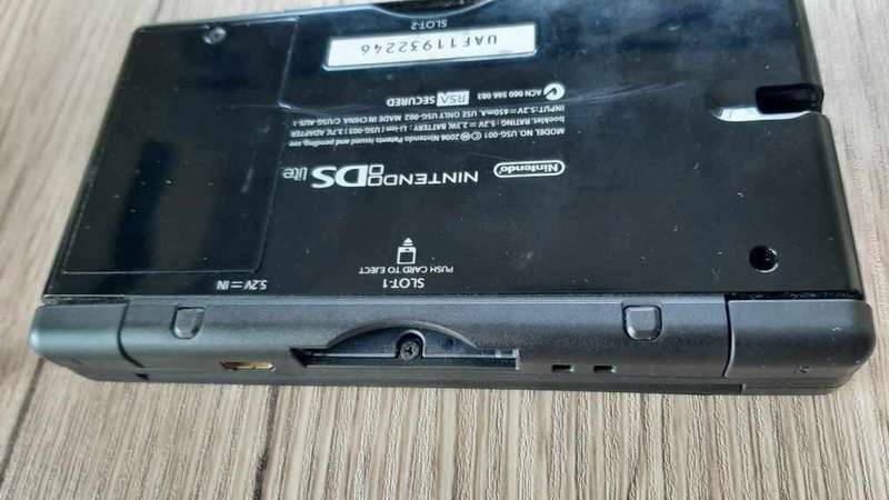Nintendo ds lite console with charger and games