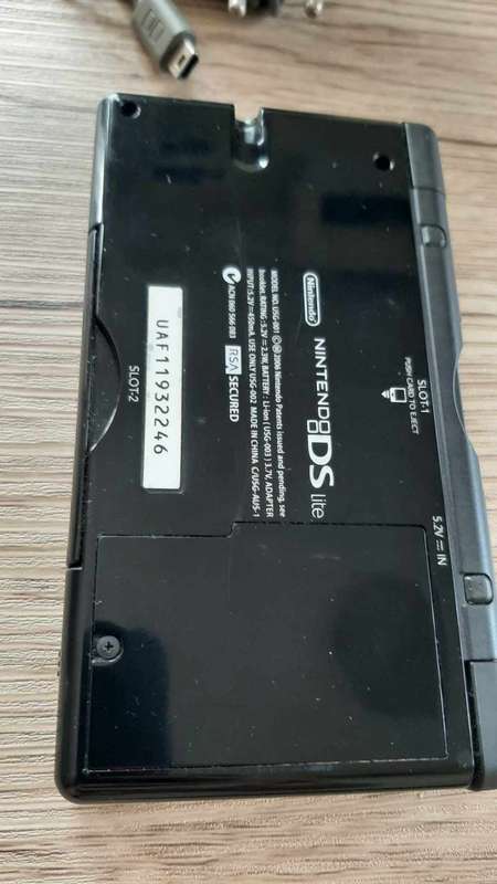 Nintendo ds lite console with charger and games