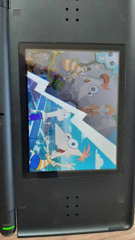 Nintendo ds lite console with charger and games
