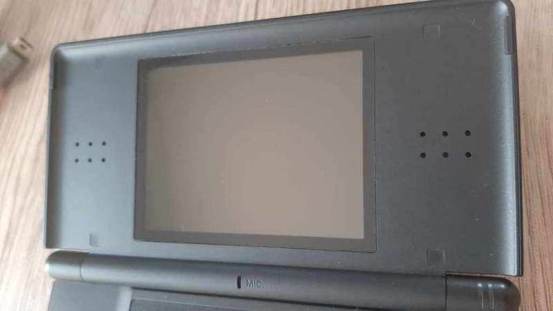 Nintendo ds lite console with charger and games