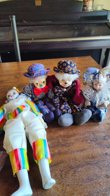 Marked down! Four collectable porcelain / ceramic clown (jester) dolls - all for one price!