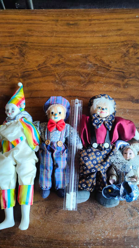 Marked down! Four collectable porcelain / ceramic clown (jester) dolls - all for one price!