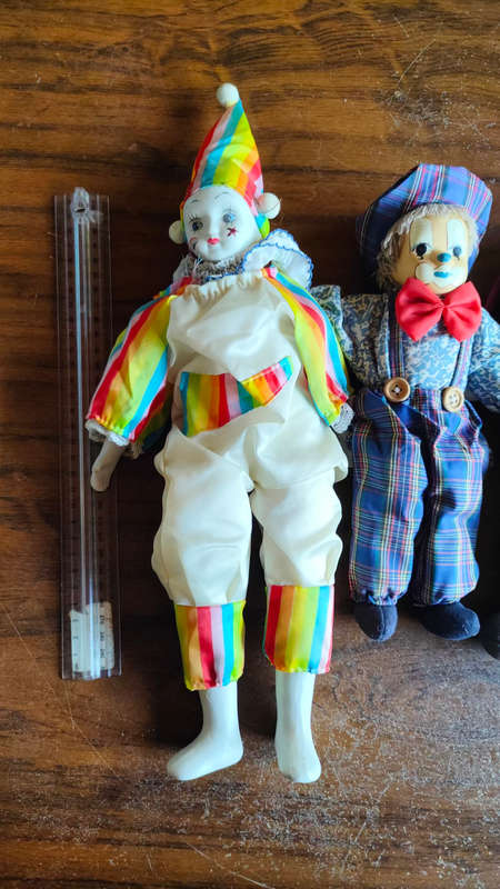 Marked down! Four collectable porcelain / ceramic clown (jester) dolls - all for one price!