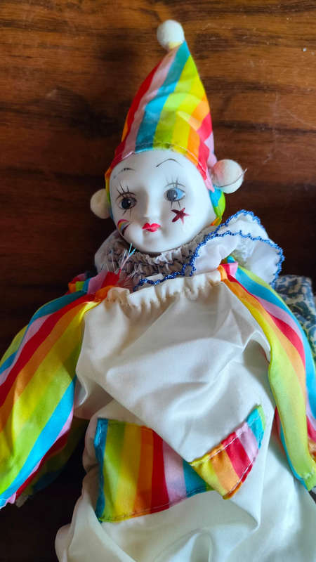 Marked down! Four collectable porcelain / ceramic clown (jester) dolls - all for one price!