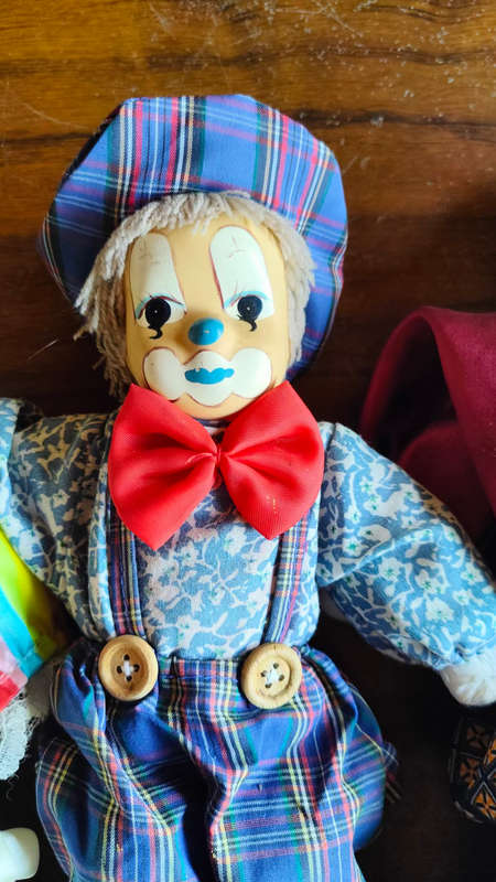 Marked down! Four collectable porcelain / ceramic clown (jester) dolls - all for one price!