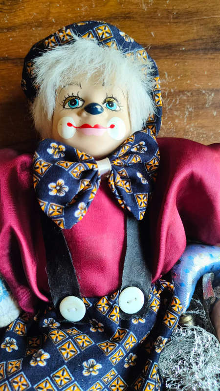 Marked down! Four collectable porcelain / ceramic clown (jester) dolls - all for one price!