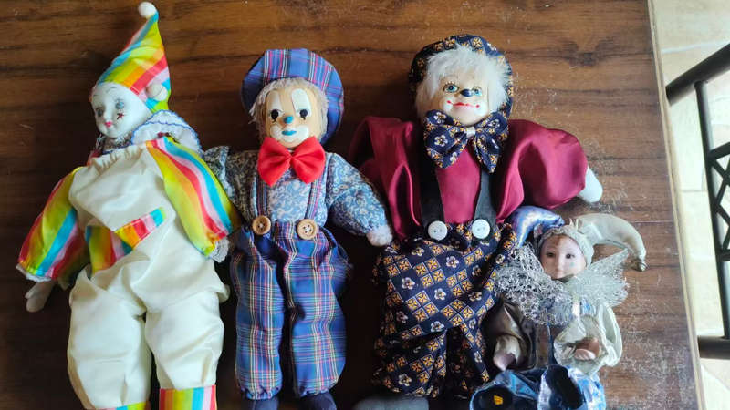 Marked down! Four collectable porcelain / ceramic clown (jester) dolls - all for one price!