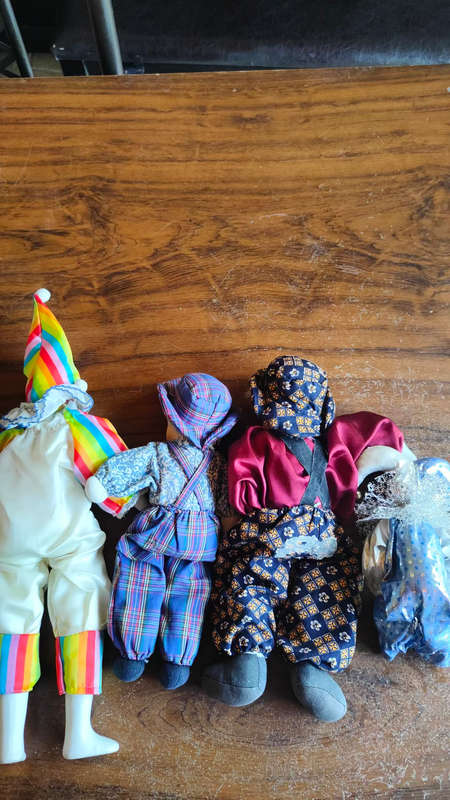 Marked down! Four collectable porcelain / ceramic clown (jester) dolls - all for one price!