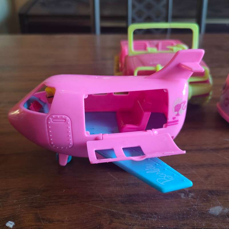 Three pink vehicles - 2 Barbie and 1 Simba