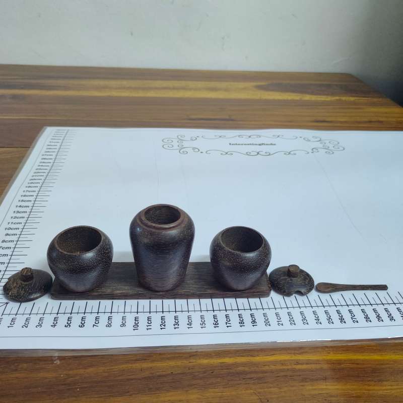 Dark wooden condiment set