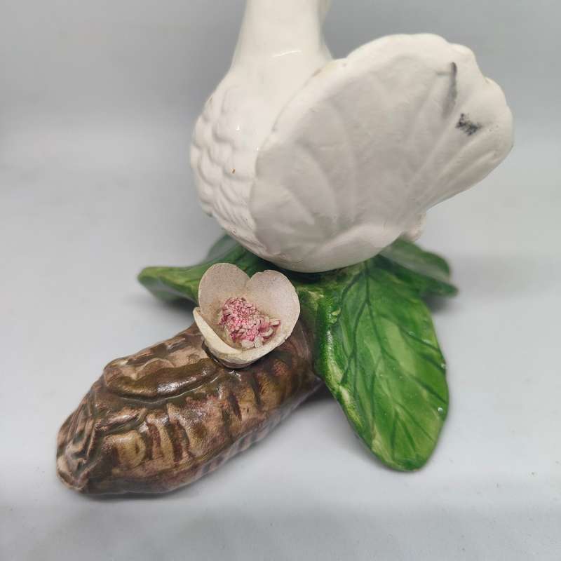 Little white dove on a log figurine.