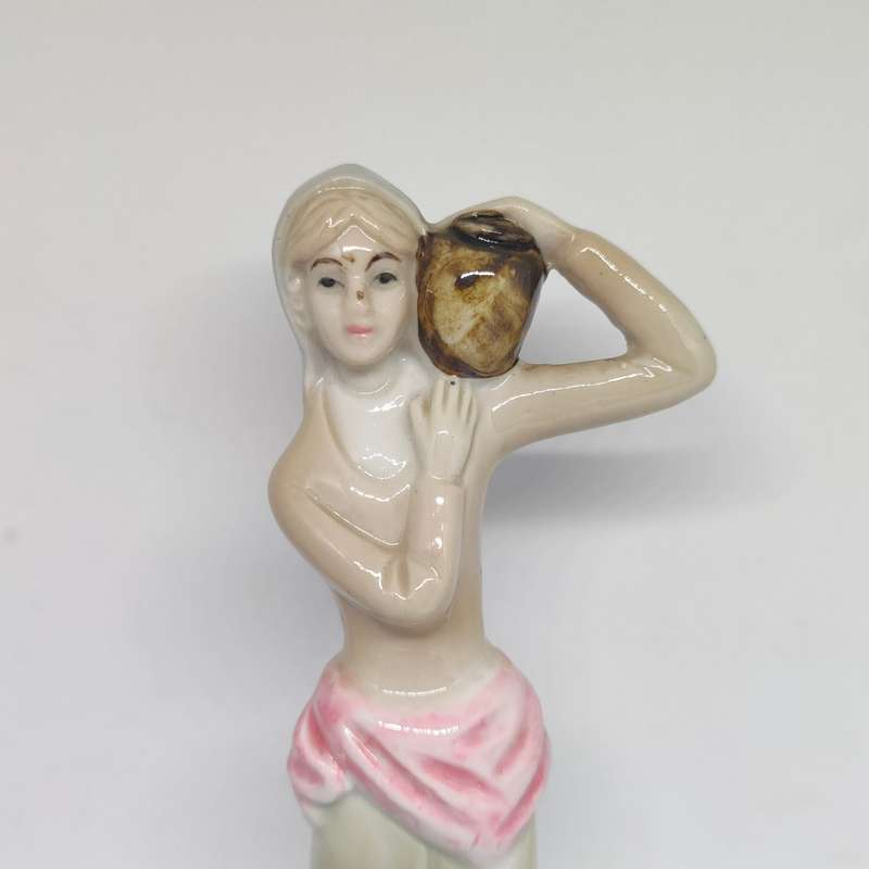 Peasant woman ceramic/porcelain figurine