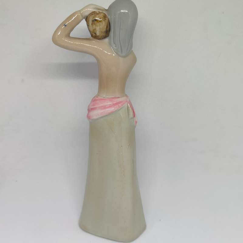 Peasant woman ceramic/porcelain figurine