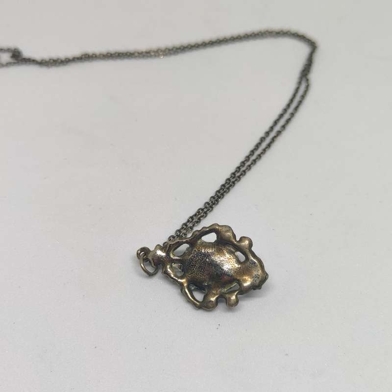 Silvertone metal necklace and pendant