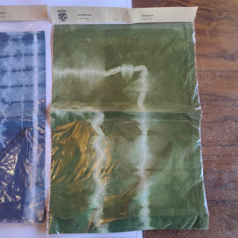 Two sealed tie-dye placemats