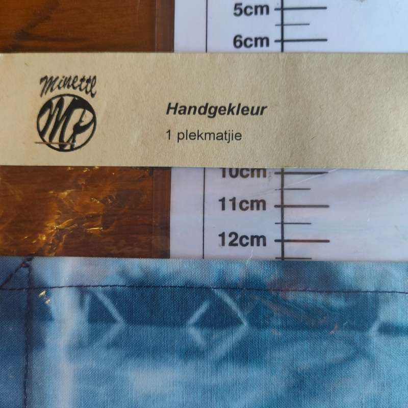 Two sealed tie-dye placemats